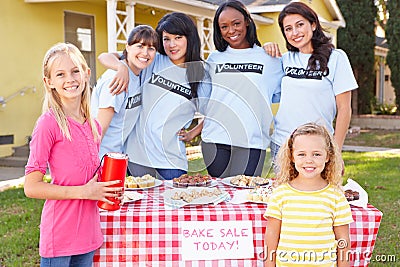 Women And Children Running Charity Bake Sale Stock Photo