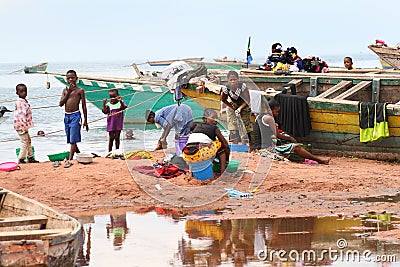 Women and children on the shore of Lake Tanganyika, Tanzania Editorial Stock Photo