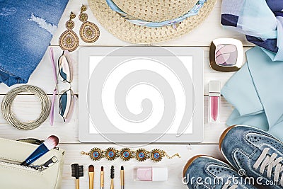 Women clothing, accessories and cosmetic on wood around tablet computer Stock Photo