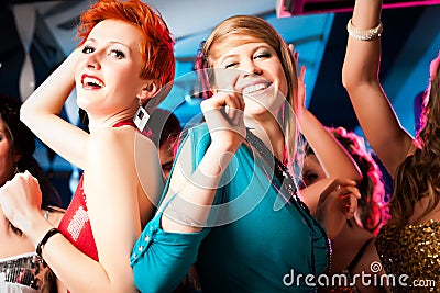 Women in club or disco dancing Stock Photo