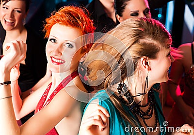 Women in club or disco dancing Stock Photo