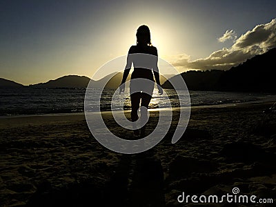 Women comes out of the sea Stock Photo