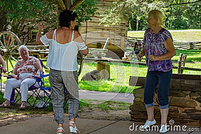 Women Dancing to Mountain Music Editorial Stock Photo