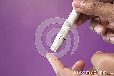 Women diabetic measure glucose level at home Stock Photo