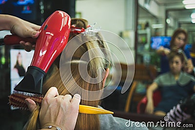 Women do hair by skilled technicians Stock Photo