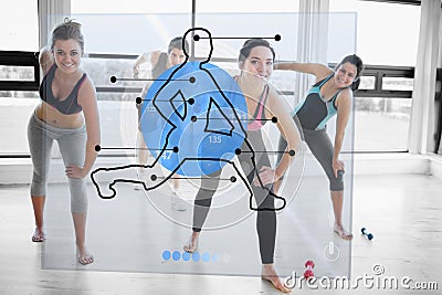 Women doing exercise with futuristic blue interface demonstration Stock Photo