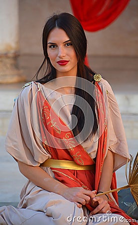 Women dressed as Roman priestess for tourists in the Old Town of Pula Editorial Stock Photo