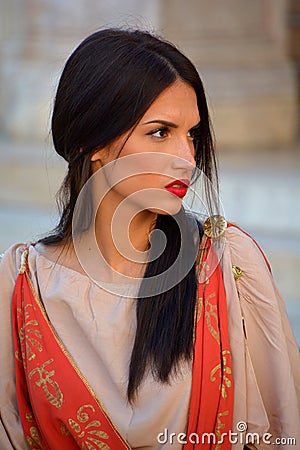 Women dressed as Roman priestess for tourists in the Old Town of Pula Editorial Stock Photo