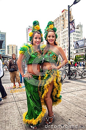 Women dressed in stylish Brazilian clothing for Brazilian Day in Toronto Editorial Stock Photo