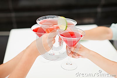 Women drink cocktails restaurant celebrating Stock Photo