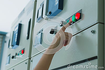 Women engineer working on checking and maintenance electrical equipment Stock Photo