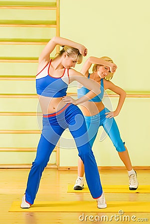 Women exercising in fitness club Stock Photo