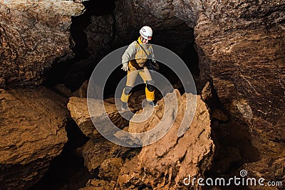 Women explore the beautiful stone cave in Ukraine Stock Photo