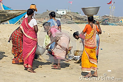 Women with fishes at the fish market Editorial Stock Photo