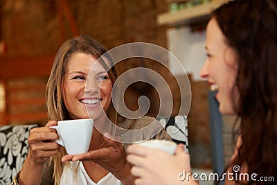 Women friends, happy and talk in cafe for reunion, thinking and smile with drink together for speaking. Girl, coffee Stock Photo