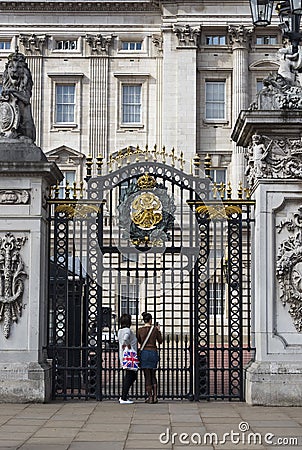 Women and Gate Editorial Stock Photo