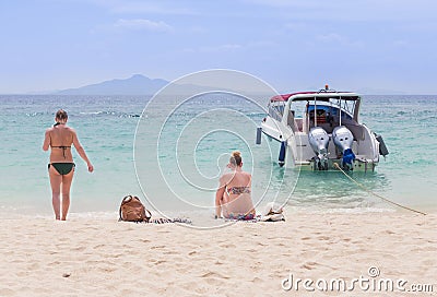 Women and girlfriend relaxing on the tropical beach and sea Editorial Stock Photo