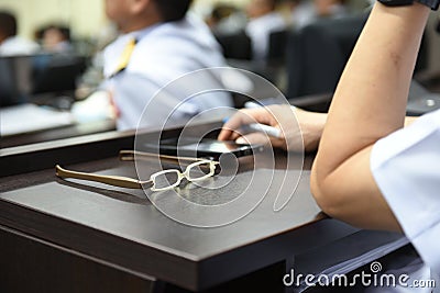 Women glasses placed on the table in the meeting room Stock Photo