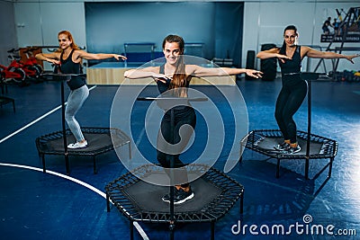 Women group on sport trampoline, fitness training Stock Photo