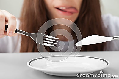 Women hand holding fork and knife Stock Photo
