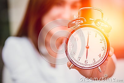 Women hand up show clock timed at 6 o& x27;clock. Stock Photo