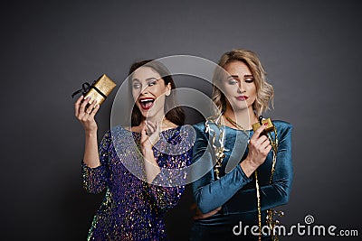 Women holding gifts in studio shot Stock Photo