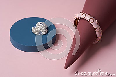 Women jewelry accessories. Heart shaped diamond brooch and bracelet Stock Photo