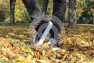 Women legs with sneakers inspired ballet movement Stock Photo