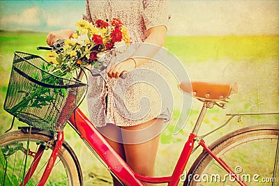 Women lifestyle in spring with colorful flowers in basket of red bicycle Stock Photo