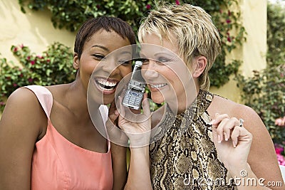 Women Listening To Cell Phone Stock Photo