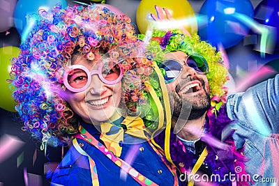 Women and men celebrating at party for new years eve or carnival Stock Photo