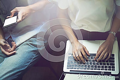 Women and men are friends. Play phone and computer Technology concepts make our lives transcend. Stock Photo