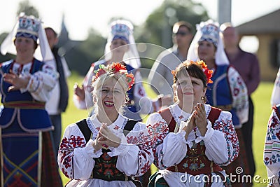 Women in national Slavic clothes at the celebration. Editorial Stock Photo