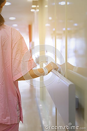 Women patient hand holding to handrail in hospital Stock Photo