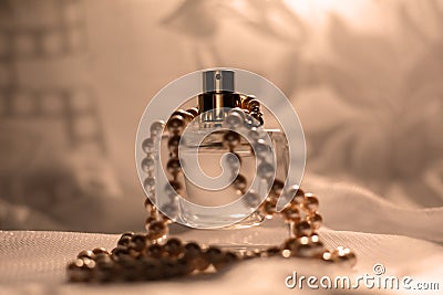 Women perfume bottle and pearls Stock Photo