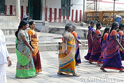 Women pilgrims in colorful sarees in the Shiva Nataraja temple Editorial Stock Photo