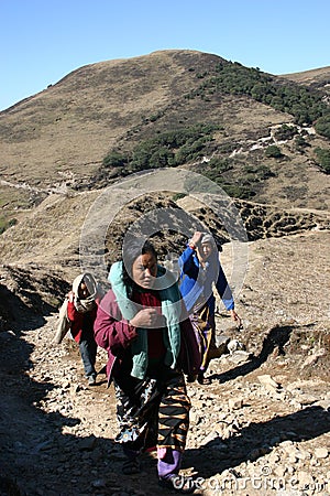 Women porter parade on a Himalayan trail Editorial Stock Photo