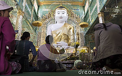 Women praying in temple, Myanmar Editorial Stock Photo