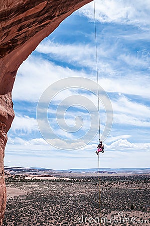 Women rappeling Stock Photo