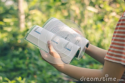 Women read holiday book in nature quiet environment Stock Photo