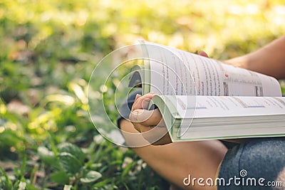 Women read holiday book in nature quiet environment Stock Photo