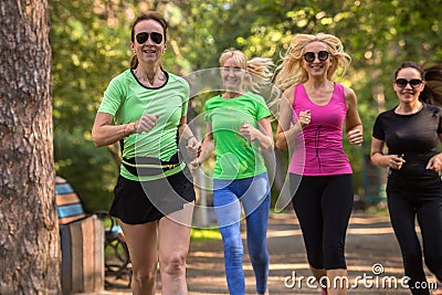 Women running in park Stock Photo