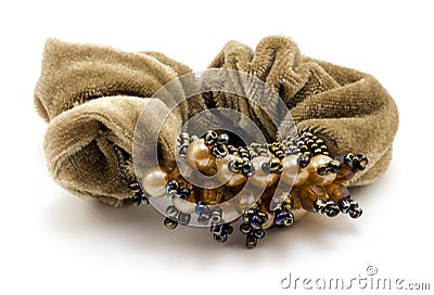 Women's brown scrunchy (hairpin) with jewelry Stock Photo