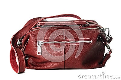 Women`s burgundy bag made of artificial textured leather with lots of metal locks Stock Photo