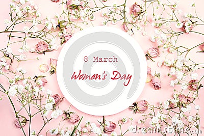 Women`s Day greeting message on white round frame with gypsophil Stock Photo