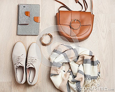 Women`s flat lay clothes shoes, scarf, bracelet, bag, tablet, sm Stock Photo