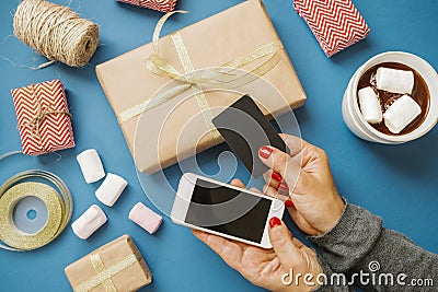 Women`s Hands with Credit Card and Phone Gifts Cocoa Marshmallow Stock Photo