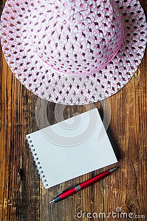 Summer woman's hat and glasses on a pink background Stock Photo