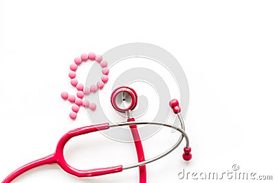 Women`s Health issues. Medical concept with Venus sign and stethoscope on white background top-down copy space Stock Photo