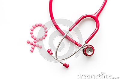 Women`s Health issues. Medical concept with Venus sign and stethoscope on white background top-down Stock Photo